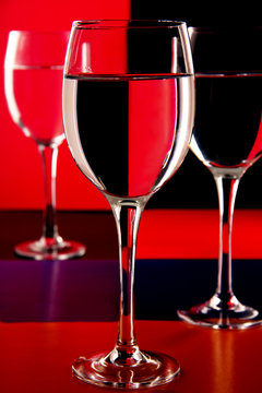 wine glasses on a colored background.