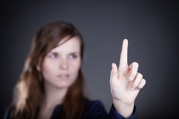 Woman's hand, one finger pointing something