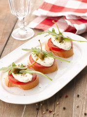 Canapes with tomatoes and mozzarella