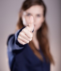 Woman's hand, thumbs up finger