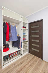 open wardrobe with clothes