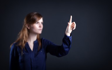 Woman's hand with finger, dark background