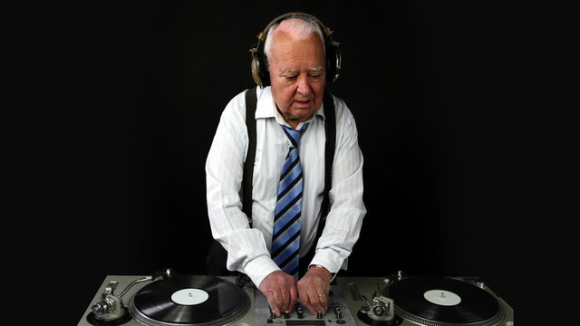 a very funky elderly grandpa dj mixing records