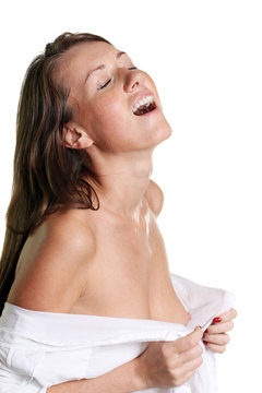 Sexual young woman in a wet white shirt