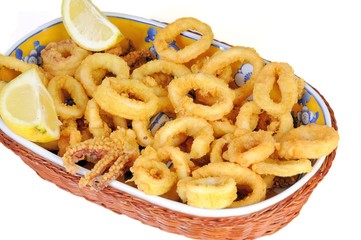 Fried calamari rings dipped in batter with lemon