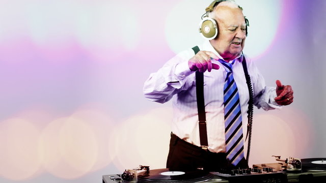 a very funky elderly grandpa dj mixing records