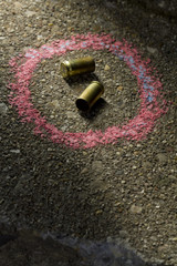 Bullets on ground with chalk drawn around