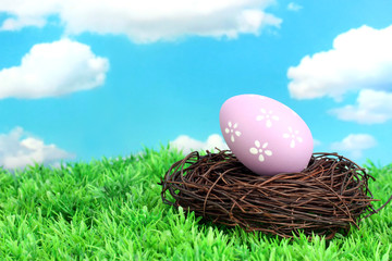 Colorful easter egg on grass