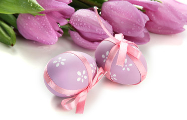 Bright easter eggs and tulips, isolated on white