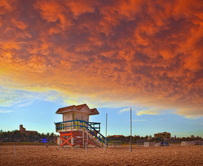 Miami Beach Florida, sunset with red storm clouds