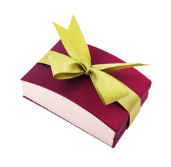 Dark red gift box with a green bow on white background