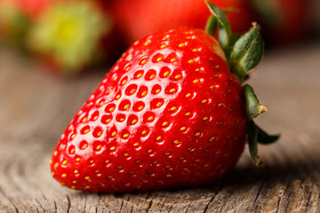 Close-up of strawberry on wooden table. 
