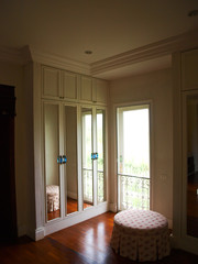 The interior of mirrored wardrobe with reflection