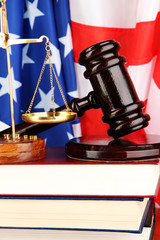 Judge gavel and books on american flag background