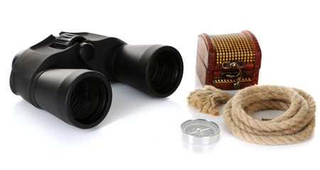 Black modern binoculars with rope and compass isolated on white