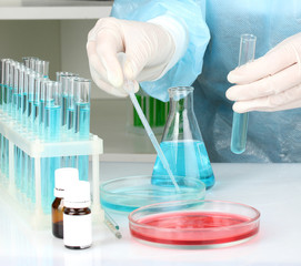 Scientist conducting research in laboratory close up