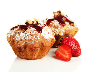 Tasty muffin cakes with strawberries, isolated on white