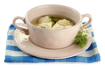 Tasty khinkali in .saucepan, isolated on white