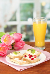 Tasty canapes with cheese, kiwi and cranberry, almond,