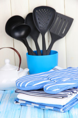 Kitchen settings: utensil, potholders, towels and else
