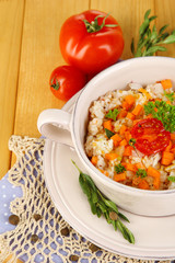 Delicious rice with vegetables and herbs in pot