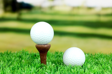 Golf balls on grass outdoor close up