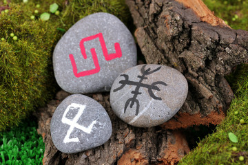 Fortune telling  with symbols on stone close up