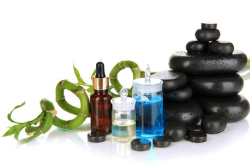 Spas composition with oils and spa stones isolated on white