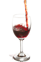 Red wine poured in a wine glass