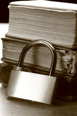 Pile of old books and keylock