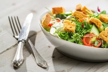 Fresh salad with arugula and tomatoes