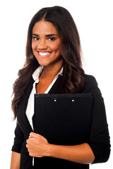 Pretty female secretary holding business files