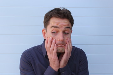 Worried doubtful face of an attractive man
