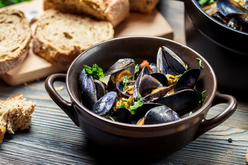 Mussels and fresh vegetables served at home