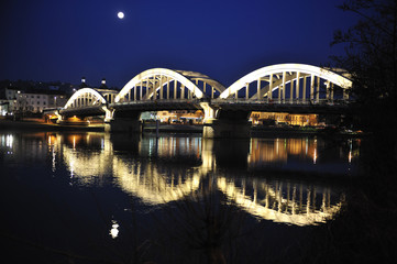 Night view of the iron bridge over the river Saone Albigny commu