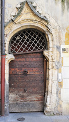Large and stately wooden doors by the Vieux Lyon, France