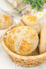 basket with homemade bread rolls closeup, top view