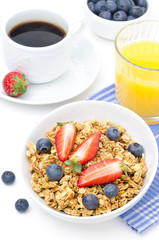 breakfast with homemade granola and fresh berries, orange juice