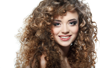 Young beautiful woman with long curly hairs on a white 