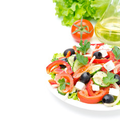 Greek salad with feta cheese, olives and vegetables