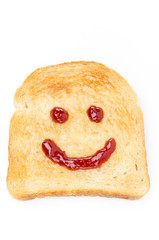 Toast with a smile of jam isolated on white