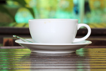 cup of coffee on wooden table