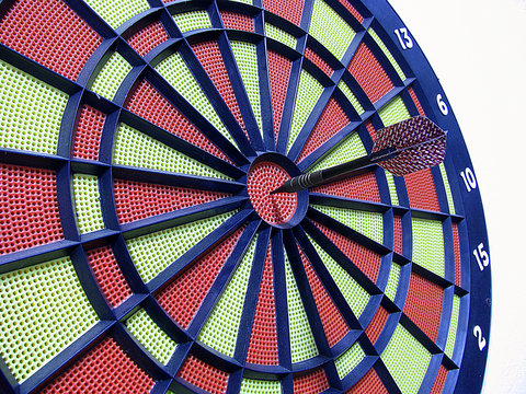 dart board with darts on white background