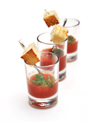 ketchup in ramekin on white background