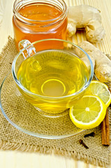 Tea ginger on a napkin of burlap with honey