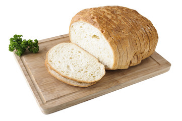 Cutted white bread on the wooden board with parsley