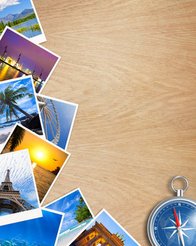Traveling photos collage with compass on wooden table