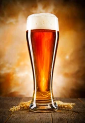 Türaufkleber Glass of beer on wooden table © Jag_cz
