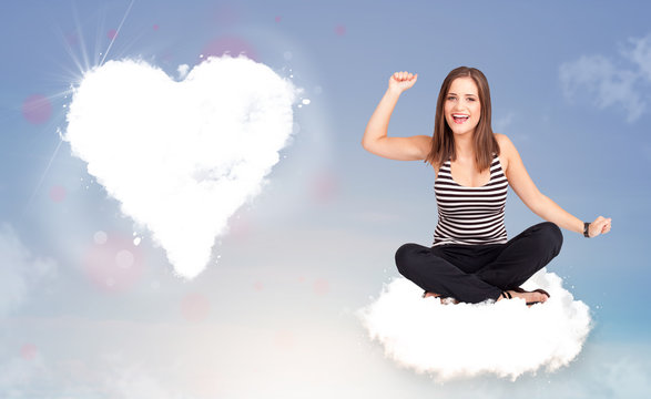 Beautiful lovely woman sitting on cloud with heart