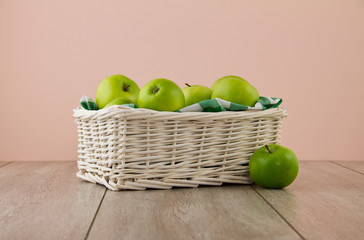 Green apples on pink